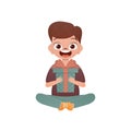 A small boy child is depicted in the lotus position and holding a box with a bow in his hands. Birthday, New Year or Royalty Free Stock Photo