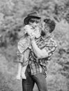 Small boy child help father in farming. father and son in cowboy hat on ranch. kid in rubber boots. happy man dad in Royalty Free Stock Photo