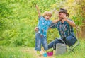 Small boy child help father in farming. happy earth day. Family tree nursering. Eco farm. watering can, pot and hoe