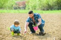 Small boy child help father in farming. new life. soils and fertilizers. rich natural soil. earth day. Eco farm. father