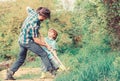 Small boy child help father in farming. rich natural soil. Eco farm. Ranch. father and son planting family tree. new