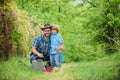 Small boy child help father in farming. watering can, pot and hoe. Garden equipment. Eco farm. father and son in cowboy