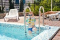 Small boy clambering out of a swimming pool Royalty Free Stock Photo