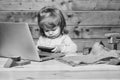 Small boy with computer and phone Royalty Free Stock Photo