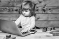 Small boy with computer and phone Royalty Free Stock Photo