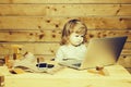 Small boy with computer and phone Royalty Free Stock Photo