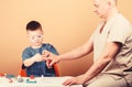 Small boy with dad in hospital. father and son in medical uniform. happy child with father with stethoscope. family