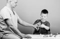 Small boy with dad in hospital. father and son in medical uniform. happy child with father with stethoscope. family