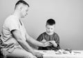 small boy with dad in hospital. father and son in medical uniform. happy child with father with stethoscope. stethoscope