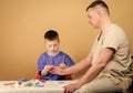 Small boy with dad in hospital. father and son in medical uniform. happy child with father with stethoscope. stethoscope