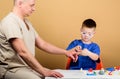 Small boy with dad in hospital. father and son in medical uniform. happy child with father with stethoscope. family