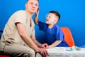 Small boy with dad in hospital. happy child with father with stethoscope. family doctor. medicine and health. father and