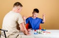 Small boy with dad play. Future career. happy child with father with stethoscope. childhood. parenting. family doctor Royalty Free Stock Photo