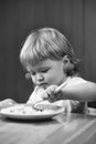 Small boy eating porridge Royalty Free Stock Photo