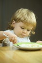 Small boy eating porridge Royalty Free Stock Photo