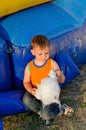 Small boy eating a portion of candy floss Royalty Free Stock Photo