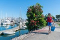 Small boy with fishing rod and bucket going fishing Royalty Free Stock Photo