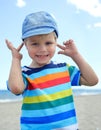 Small boy holds his hands over ears not to hear Royalty Free Stock Photo