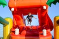 Small boy jumping in bouncy castle Royalty Free Stock Photo