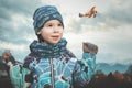 Small boy is looking to small plane in blue sky to let dream fly Royalty Free Stock Photo