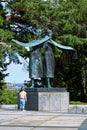 small boy looks on big statue Royalty Free Stock Photo