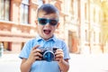 Small boy is making excited face trying to take a shot in the ci Royalty Free Stock Photo