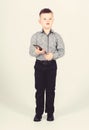 Small boy with mobile phone. little boss. Ceo direstor. childhood. Business communication. confident child has business Royalty Free Stock Photo