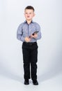 Small boy with mobile phone. little boss. Ceo direstor. childhood. Business communication. confident child has business Royalty Free Stock Photo