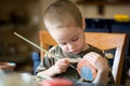 Small boy pains the clay jar Royalty Free Stock Photo