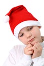 Small boy in Santa's red hat isolated on white