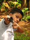 A small boy showing the gun. Royalty Free Stock Photo