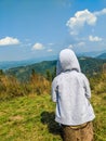 Small boy sitting on the carpathian mountains background Royalty Free Stock Photo