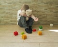 Small sad boy sitting on the floor expression tenderness unhappy a block depression frustratedsadness Royalty Free Stock Photo