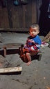 Small boy sitting outdoors