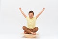 Small boy is sitting on a special simulator for training vestibular apparatus Royalty Free Stock Photo