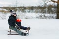 Small boy sledding at winter time. Motion blur Royalty Free Stock Photo