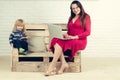 Small boy and teacher girl in glasses, blogging Royalty Free Stock Photo