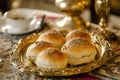 Small bread rolls with seeds on a gold plate. Royalty Free Stock Photo