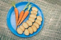 Small bread slices, carrots and butter rosemary on Royalty Free Stock Photo