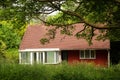 Small brick home in the wood Royalty Free Stock Photo