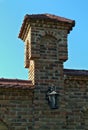 Small bricks tower on monastery fence, closeup Royalty Free Stock Photo