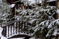 A small bridge covered with snow on the background of Christmas trees. Suburban winter landscape Royalty Free Stock Photo