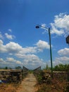 small bridge decorated with clouds and blue sky