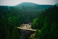 Small bridge over the Malbaie River surrounded by greenery in Quebec, Canada Royalty Free Stock Photo