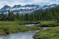 Small bridge over river in beautiful alpine landscape Royalty Free Stock Photo