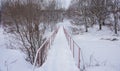 Small bridge over river in winter Royalty Free Stock Photo