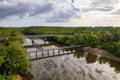 Small bridge passing small river to the sea