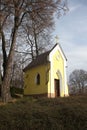 a small bright yellow chapel on the hill Royalty Free Stock Photo