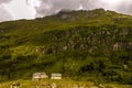 Small broken houses under grey clouds in Apls Royalty Free Stock Photo