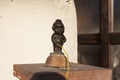 Small bronze statue of the famous Mannekene Pis, the iconic statue of in Uzhgorod Ukraine photo - April 1, 2017